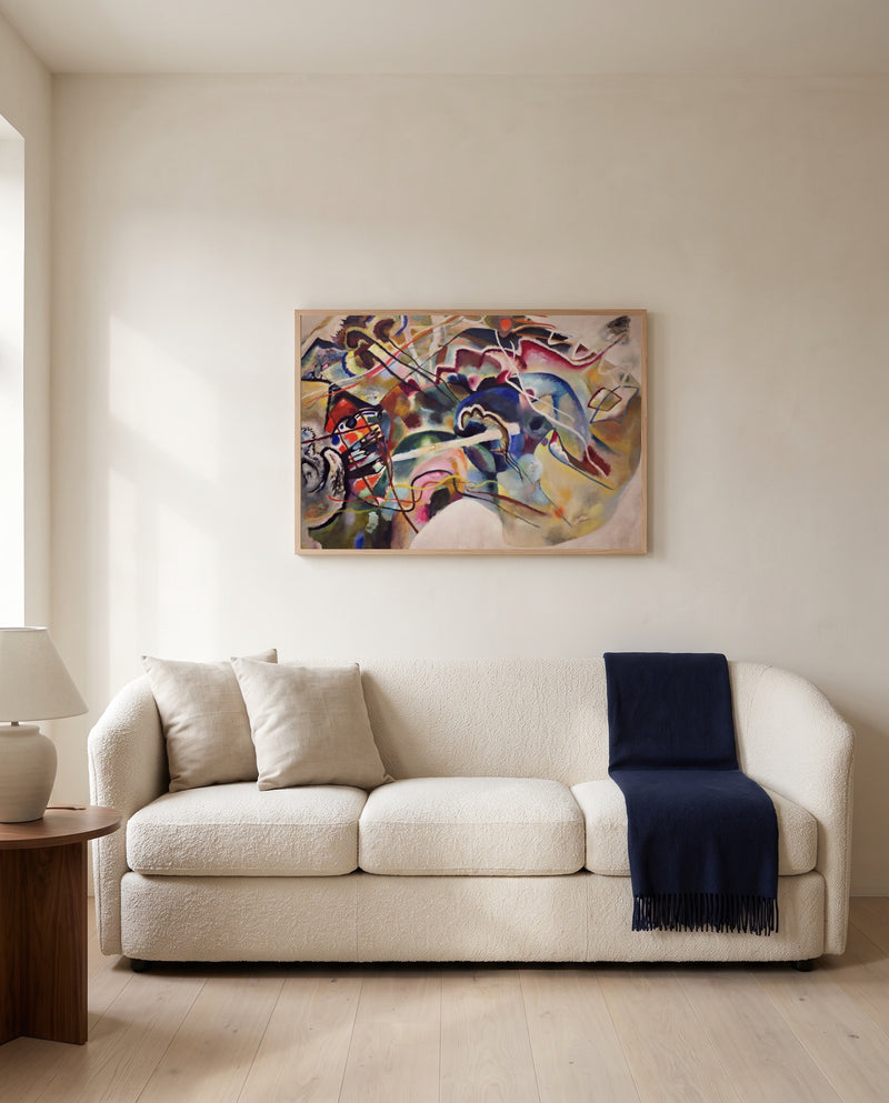 Painting with White Border by Wassily Kandinsky framed in natural oak above a cream sofa in a warm living room