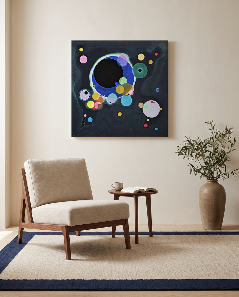 Several Circles by Wassily Kandinsky as a stretched canvas above a linen lounge chair in a reading corner