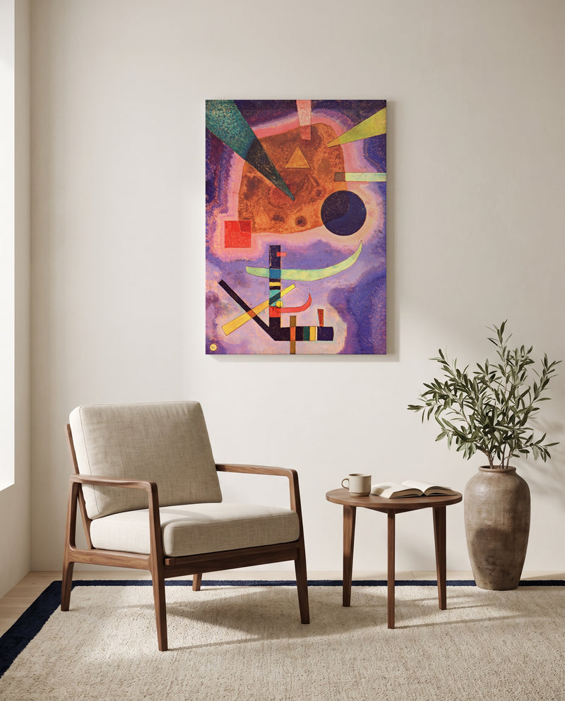 Three Elements by Wassily Kandinsky as a stretched canvas above a linen lounge chair in a reading corner