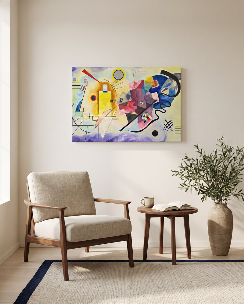 Yellow-Red-Blue by Wassily Kandinsky as a stretched canvas above a linen lounge chair in a reading corner
