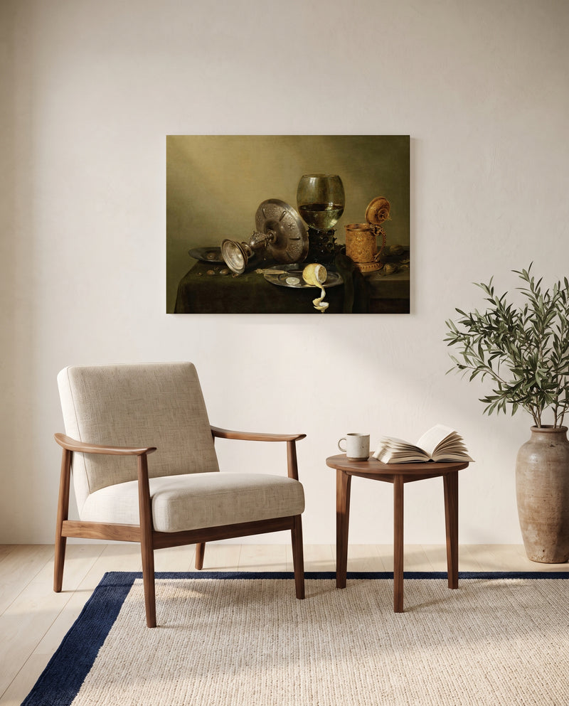 Gilded Beer Tankard by Willem Claesz. Heda as a stretched canvas above a linen lounge chair in a reading corner