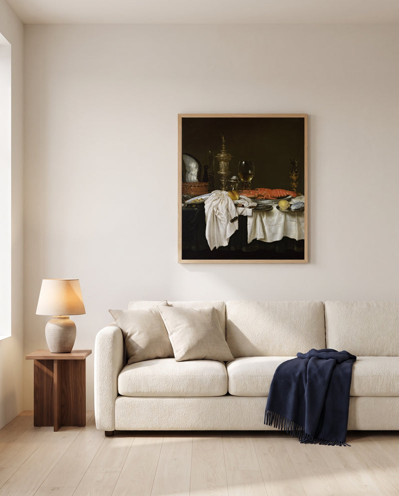 Still Life with a Lobster by Willem Claesz. Heda framed in natural oak above a cream sofa in a warm living room