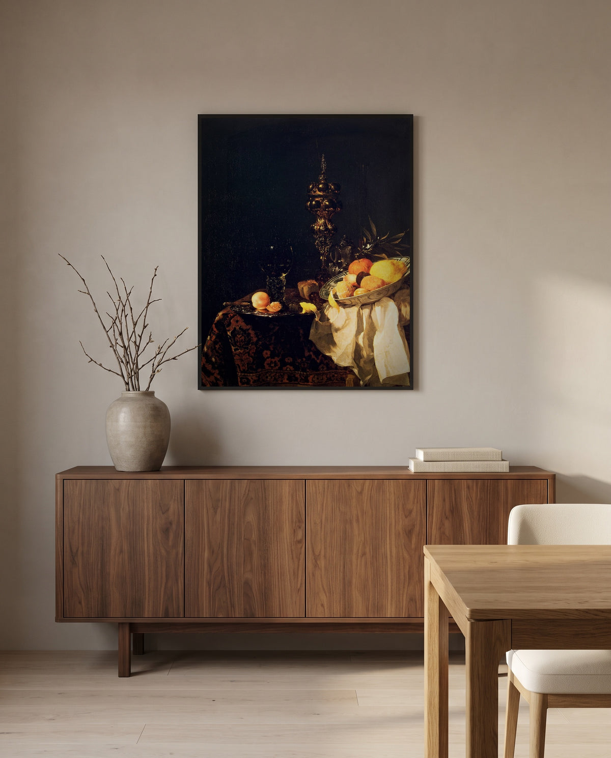 Dessert by Willem Kalf in a black frame above a walnut sideboard in a dining room