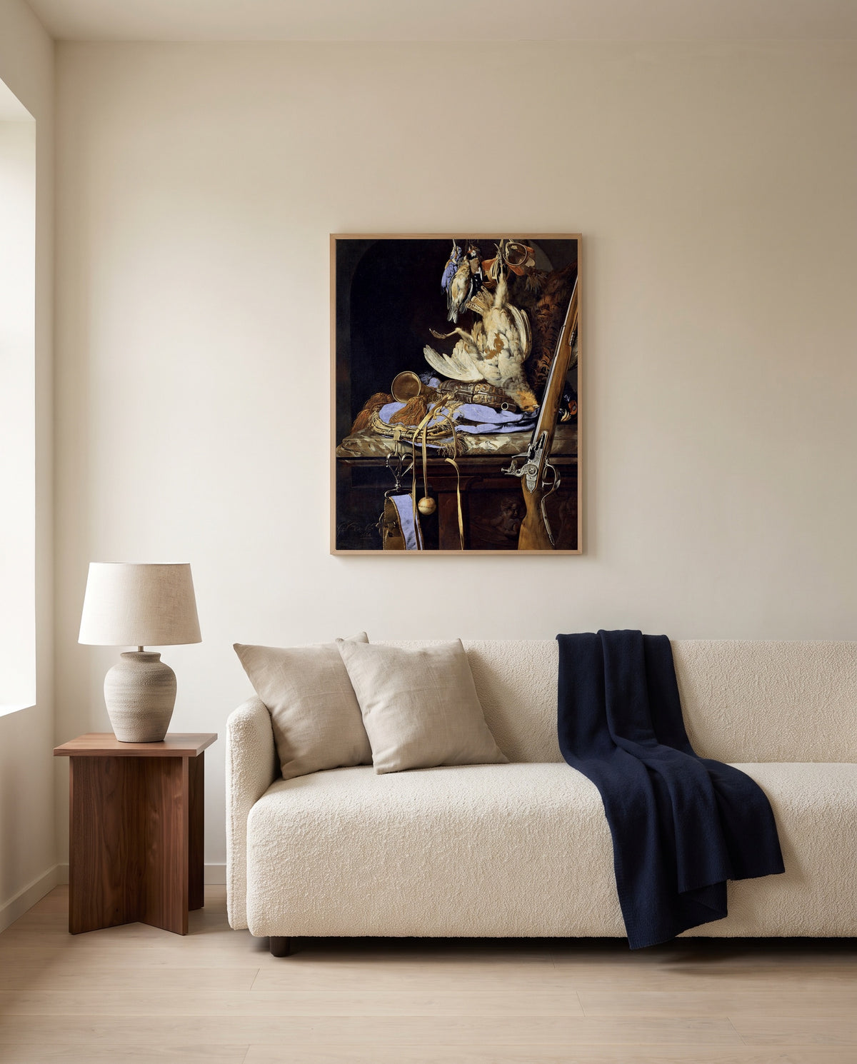 Dead Birds and Hunting Gear by Willem van Aelst framed in natural oak above a cream sofa in a warm living room
