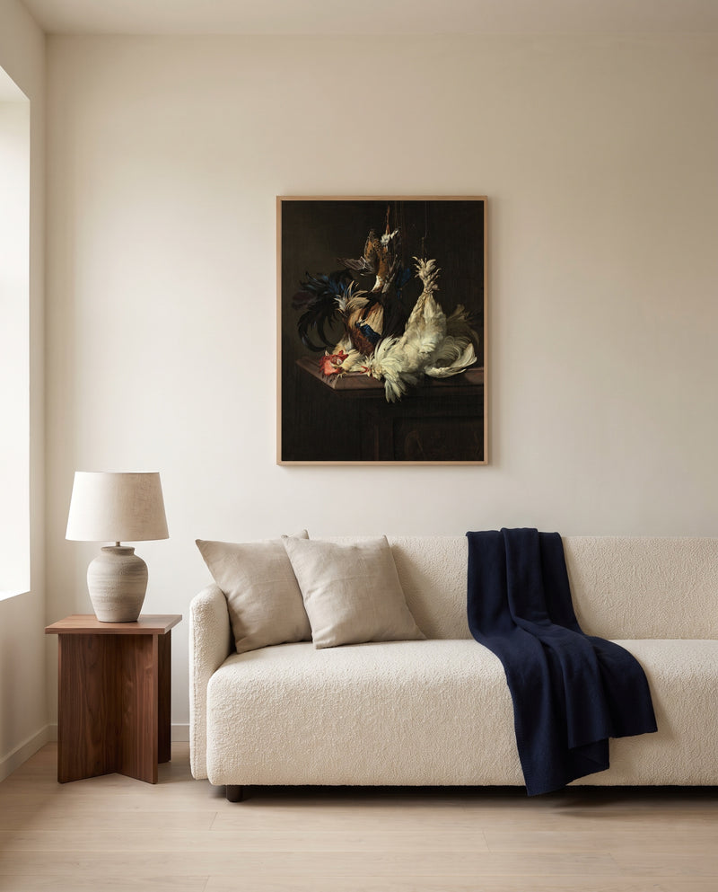 Still Life with Fowl by Willem van Aelst framed in natural oak above a cream sofa in a warm living room