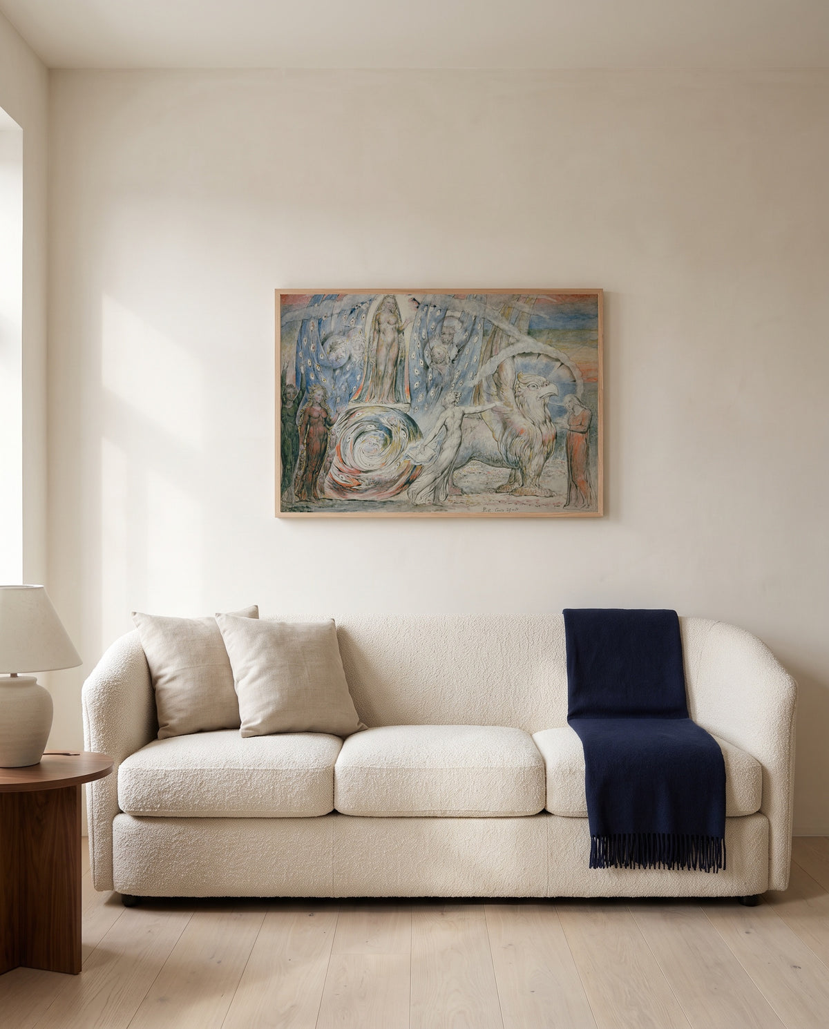 Beatrice Addressing Dante by William Blake framed in natural oak above a cream sofa in a warm living room