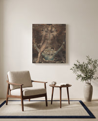 Dragon and the Beast by William Blake as a stretched canvas above a linen lounge chair in a reading corner
