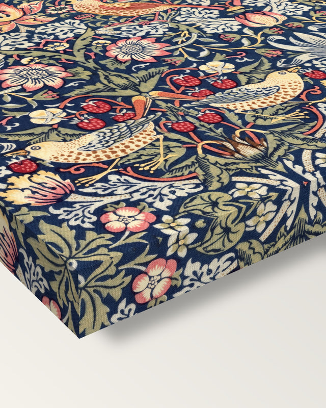 Strawberry Thief by William Morris on stretched canvas, corner close-up: the painting mirror-wrapped round the sides