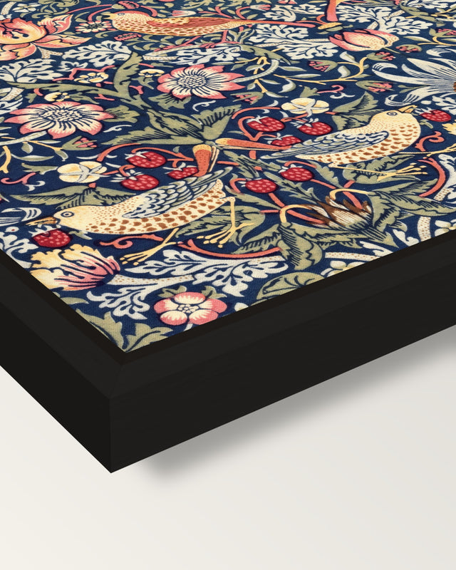 Strawberry Thief by William Morris framed canvas, corner close-up: a black floating frame with a shadow gap round the canvas