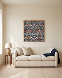 Strawberry Thief by William Morris framed in natural oak above a cream sofa in a warm living room