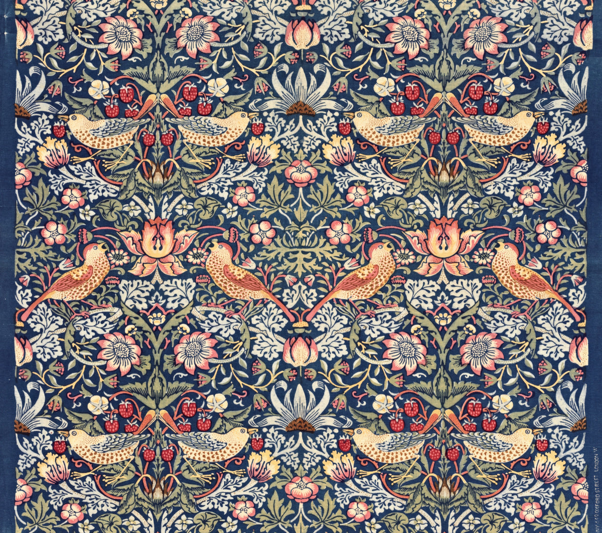 Strawberry Thief by William Morris: pairs of speckled thrushes with red strawberries among flowers on deep indigo blue