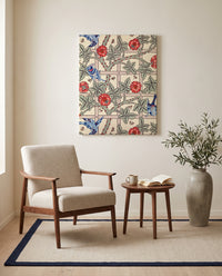 Trellis by William Morris as a stretched canvas above a linen lounge chair in a reading corner
