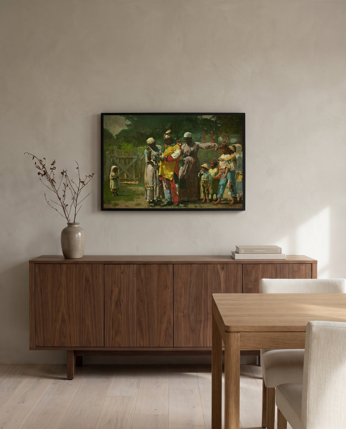 Dressing for the Carnival by Winslow Homer in a black frame above a walnut sideboard in a dining room