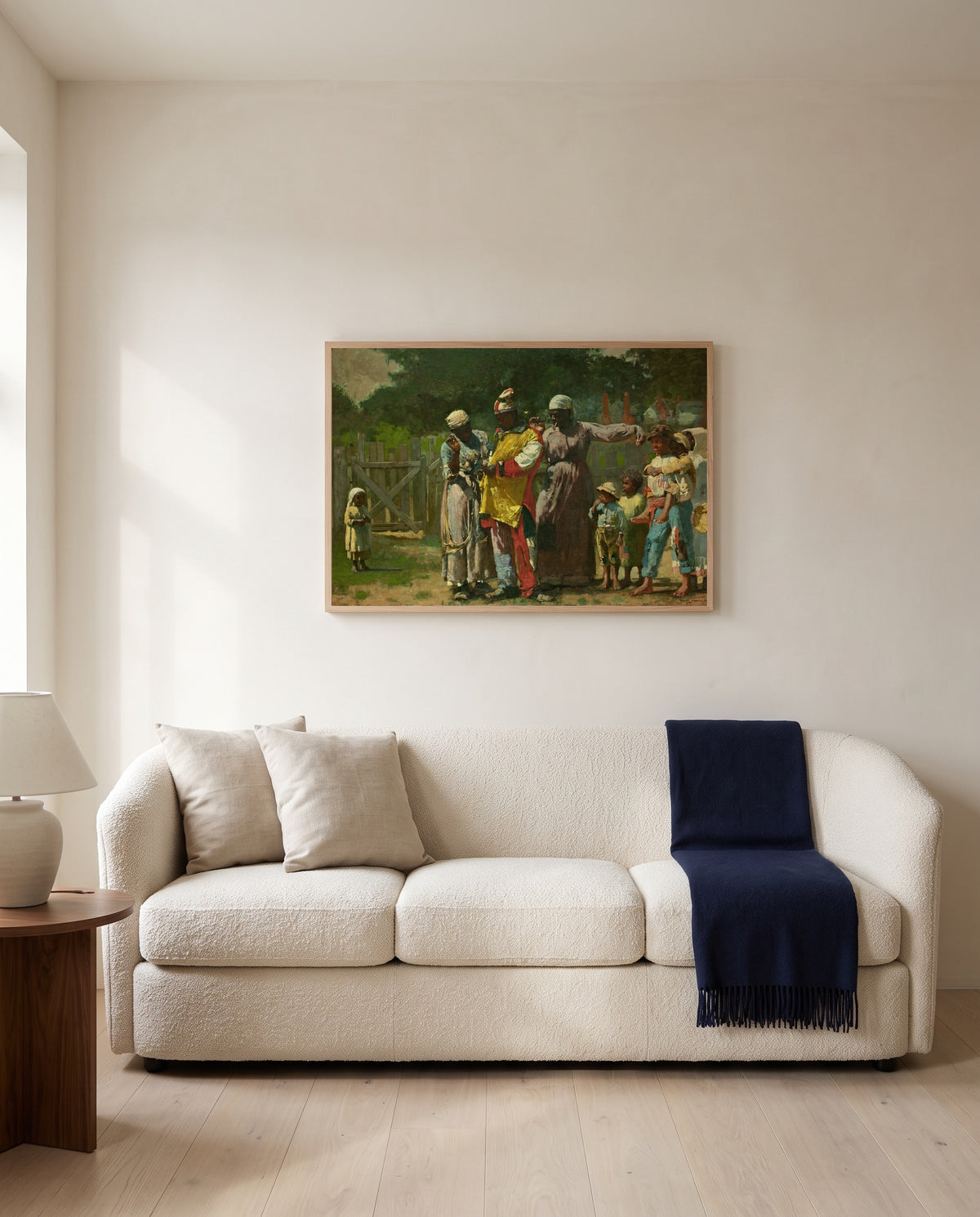 Dressing for the Carnival by Winslow Homer framed in natural oak above a cream sofa in a warm living room
