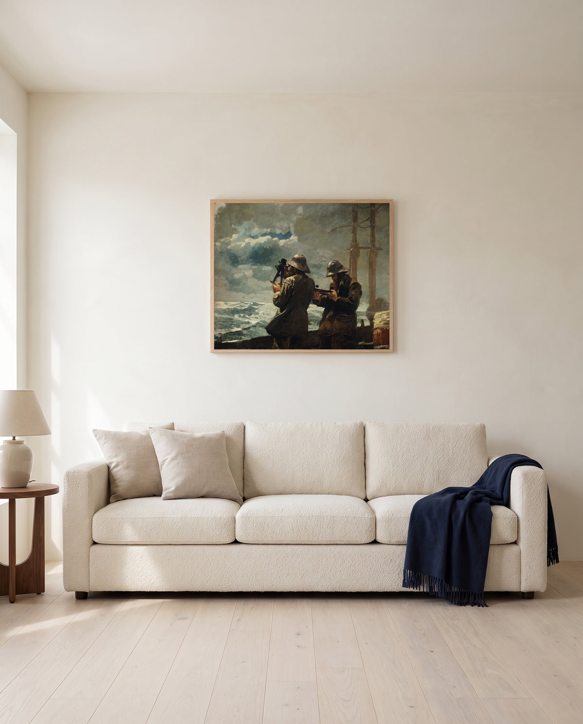 Eight Bells by Winslow Homer framed in natural oak above a cream sofa in a warm living room