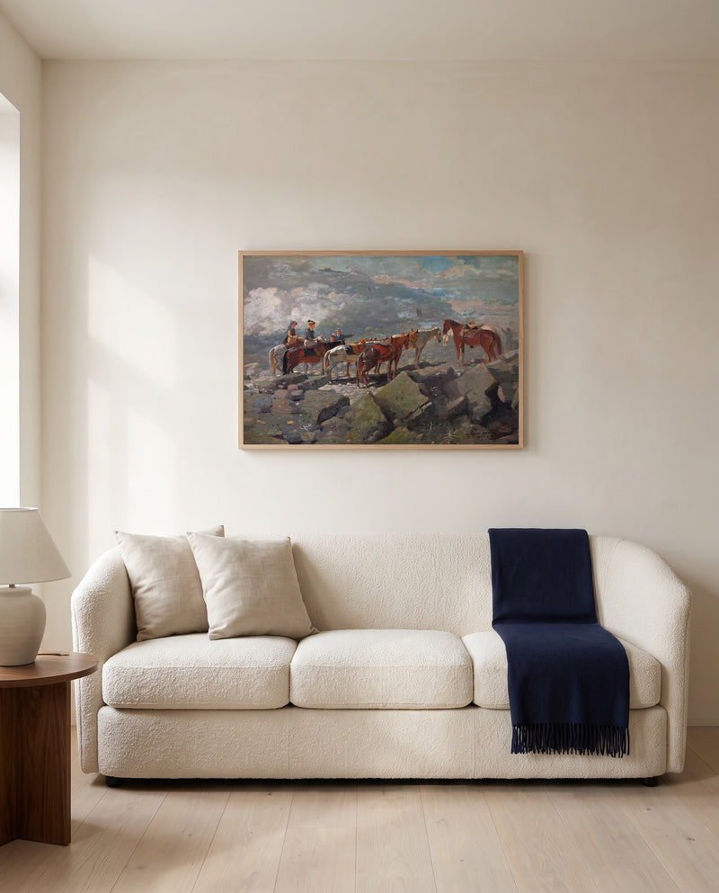 Mount Washington by Winslow Homer framed in natural oak above a cream sofa in a warm living room