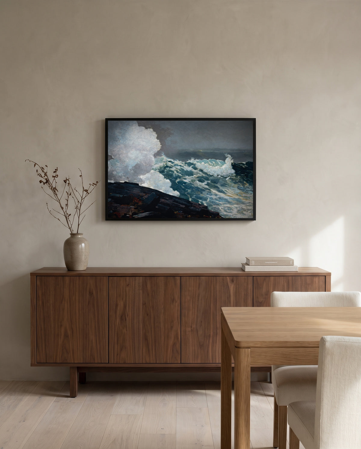 Northeaster by Winslow Homer in a black frame above a walnut sideboard in a dining room