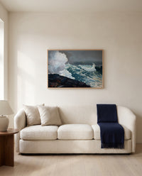 Northeaster by Winslow Homer framed in natural oak above a cream sofa in a warm living room