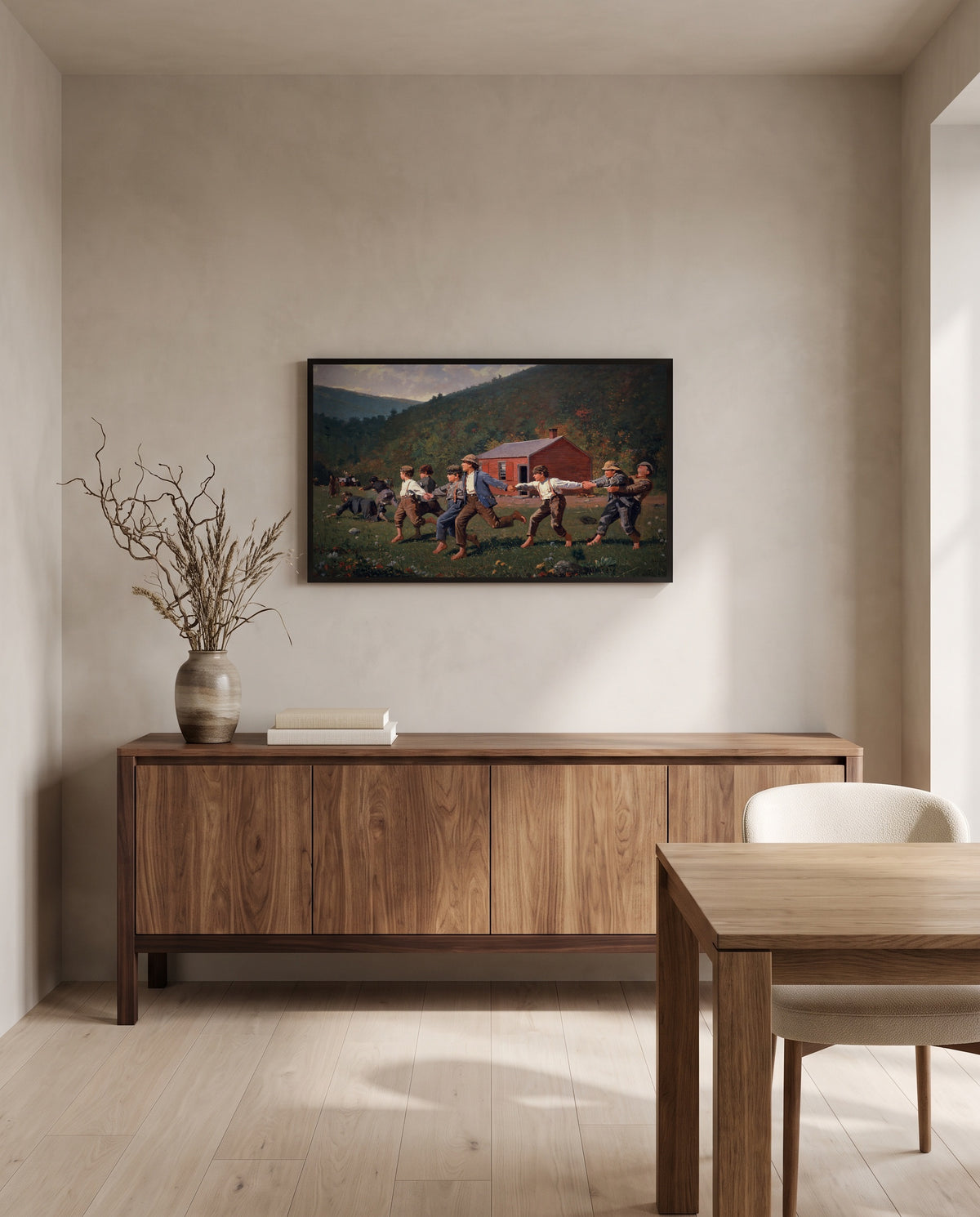 Snap the Whip by Winslow Homer in a black frame above a walnut sideboard in a dining room