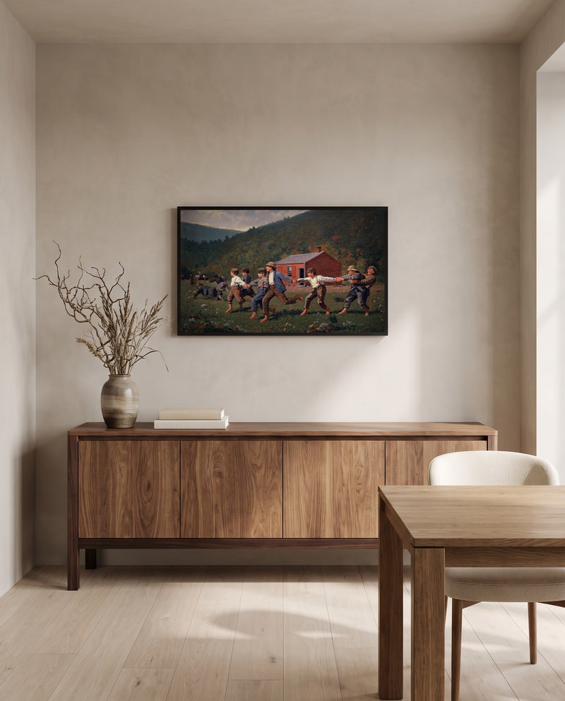 Snap the Whip by Winslow Homer in a black frame above a walnut sideboard in a dining room
