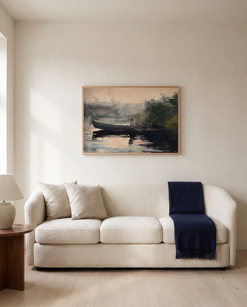 The End of the Day by Winslow Homer framed in natural oak above a cream sofa in a warm living room