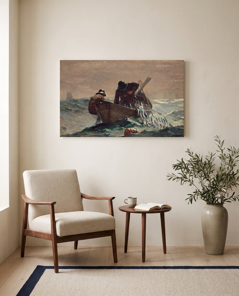 The Herring Net by Winslow Homer as a stretched canvas above a linen lounge chair in a reading corner