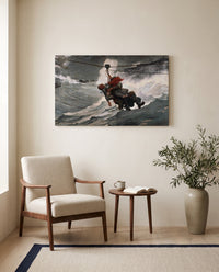 The Life Line by Winslow Homer as a stretched canvas above a linen lounge chair in a reading corner
